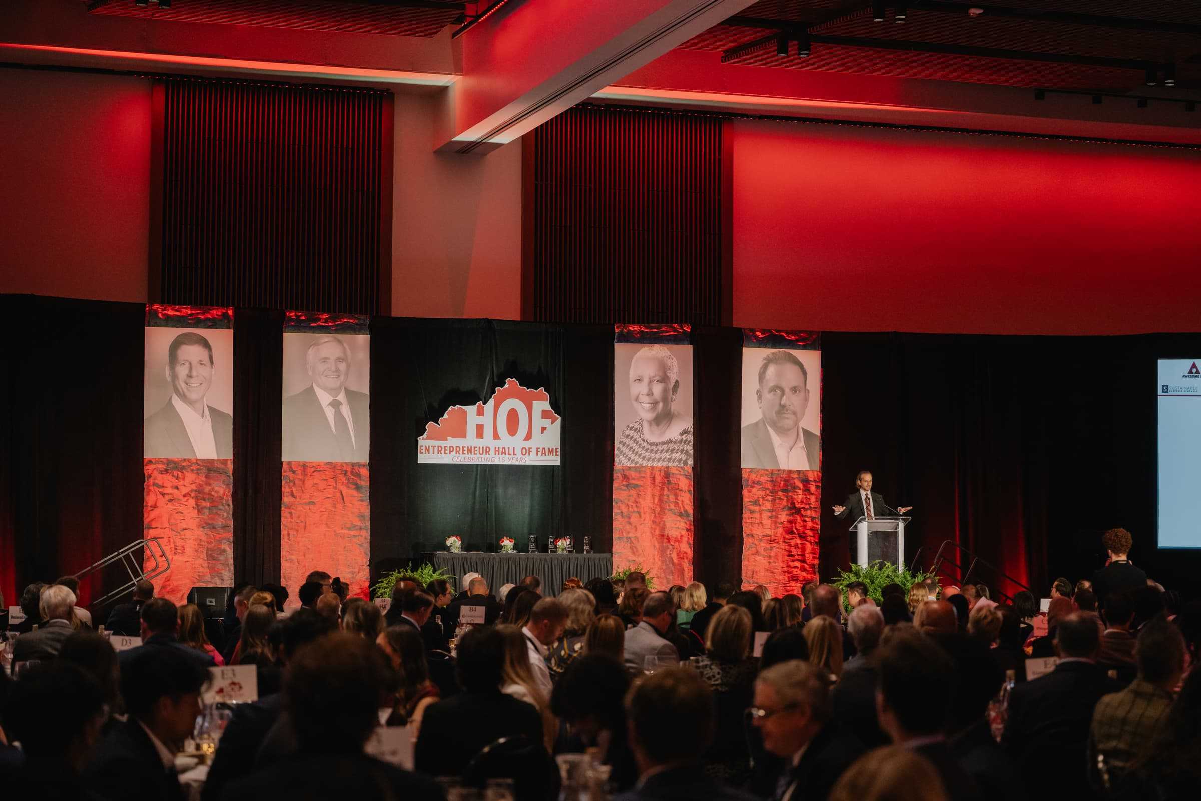 Speaker addressing the crowd at the Hall of Fame induction ceremony